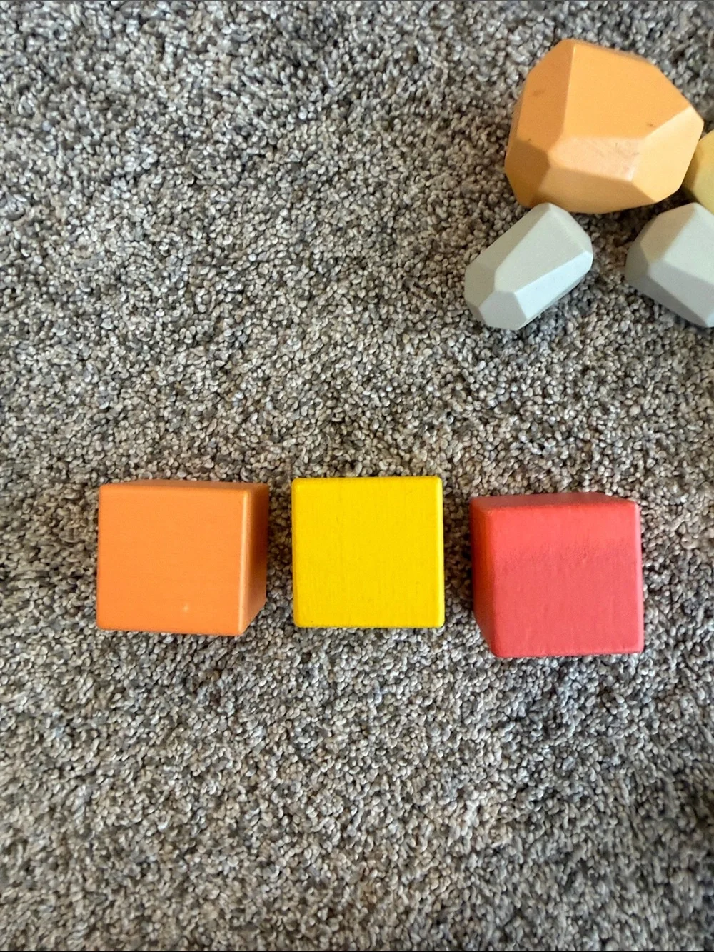 Lovevery bundle of Colorful Wooden Stacking Blocks, Light & Heavy Balls & Doll